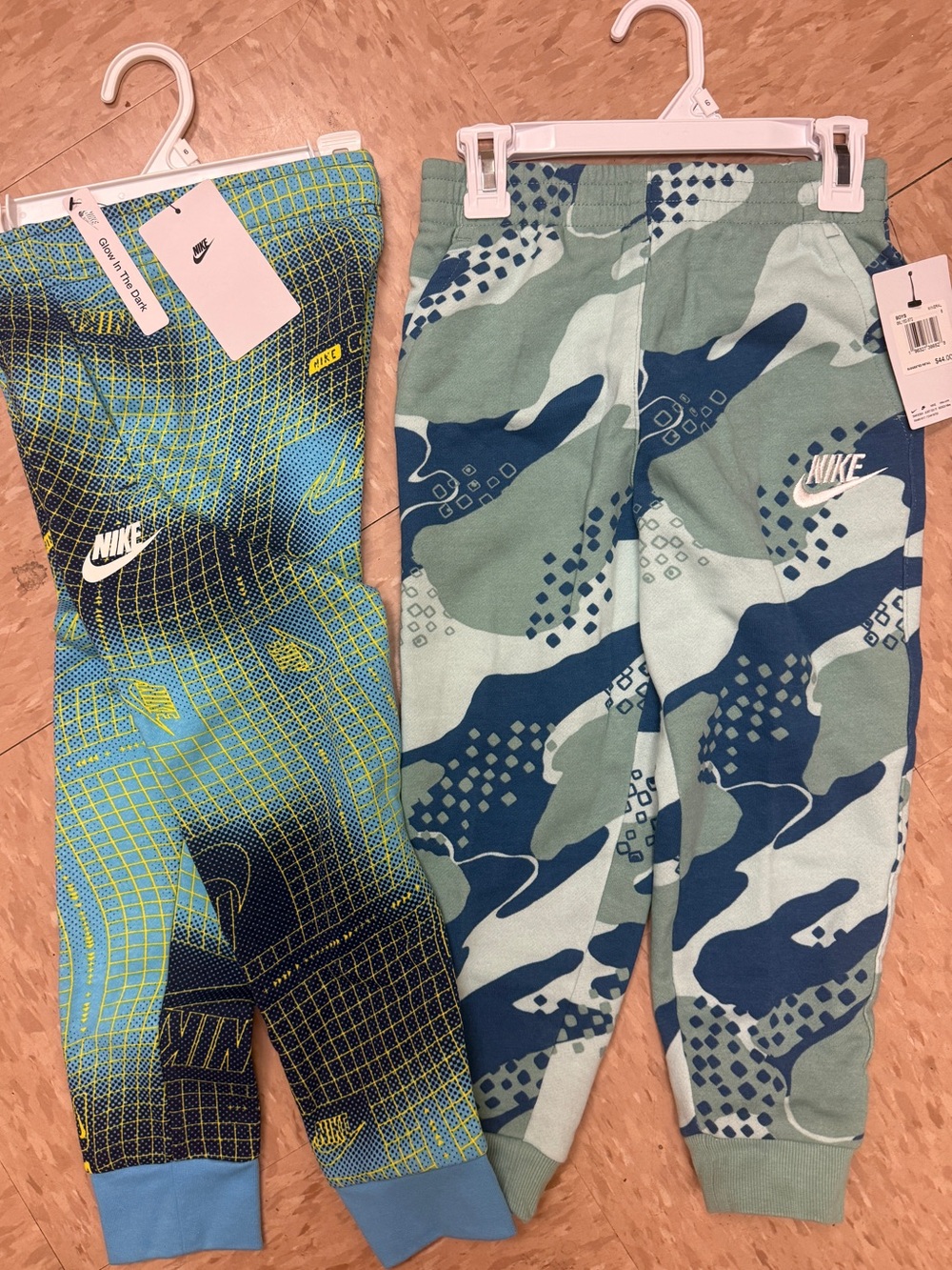 NEW WITH TAGS- 2 pair of Nike pants - size 6